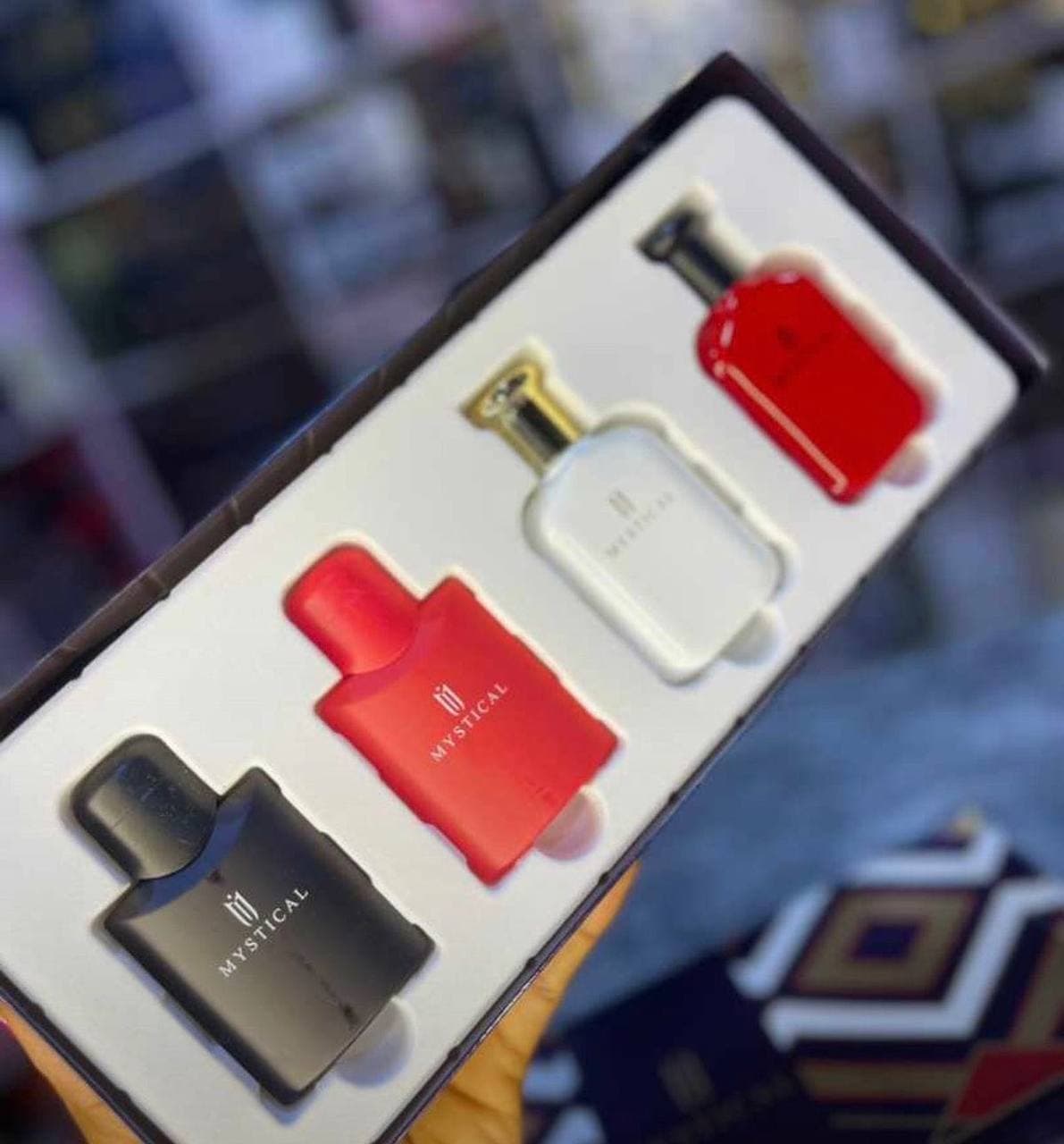 Mini perfume bottles in red, white and black